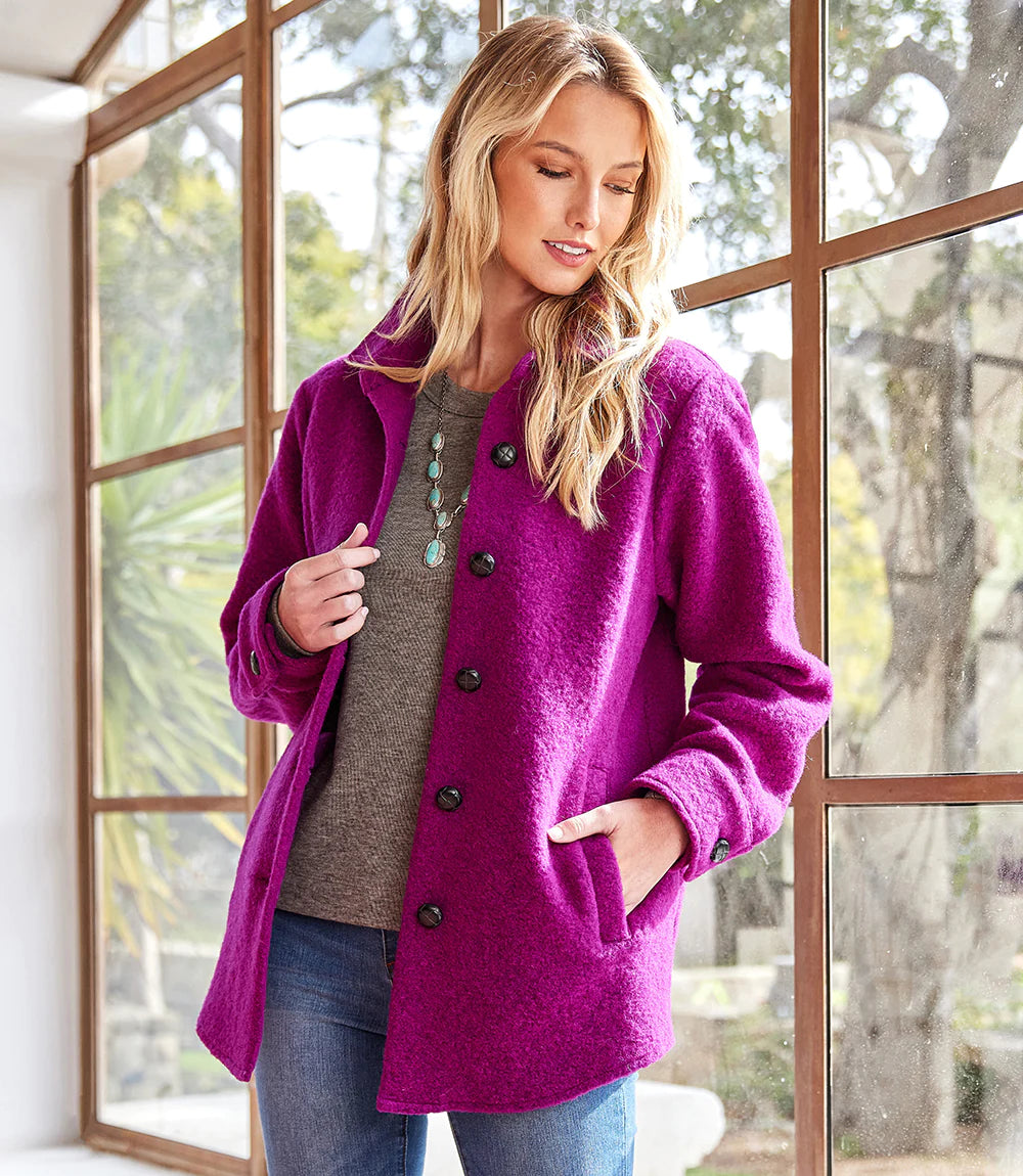 This magenta-hued shirt jacket provides timeless cold-weather styling, boasting a relaxed fit that offers effortless wear. Its vivid color ensures it stands apart from all the rest.  Color- Magenta. Long cuffed sleeve. Side functional pockets. Lined. Made of Italian fabric. 56% Wool. 40% Polyester. 4% Acrylic.