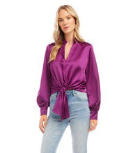 Load image into Gallery viewer, This top is crafted from a silky fabric and features a stand-up collar and tie waistband for an elegant aesthetic. The remarkable Magenta color adds a bold statement to any look, whether you choose to dress it up or down with denim.  Color - Magenta. Blouson Sleeve. Tie at waist. Button down. No pockets. Long sleeve. Satin fabrication.
