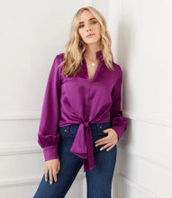 Load image into Gallery viewer, This top is crafted from a silky fabric and features a stand-up collar and tie waistband for an elegant aesthetic. The remarkable Magenta color adds a bold statement to any look, whether you choose to dress it up or down with denim.  Color - Magenta. Blouson Sleeve. Tie at waist. Button down. No pockets. Long sleeve. Satin fabrication.
