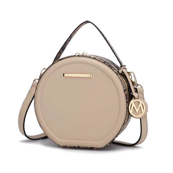 This Mallory Cross-body offers luxurious style, featuring high-quality vegan leather with gold tone embellishments and hand-painted edges in snake print. It features a top zipper closure, two interior pockets, and one interior zipper pocket with the signature Mia K. Collection Plate. This cross-body has a circle one-compartment style and adjustable strap for optimal comfort.   Color- Beige. High-quality vegan leather.