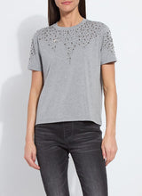 Load image into Gallery viewer, Model wearing a rhinestone embellished dark grey, short sleeve top and grey jeans against a white background.
