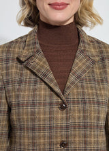Load image into Gallery viewer, A close-up of a model wearing a brown turtleneck and brown and sparkle blazer against a white background.
