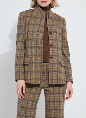Model wearing a brown plaid suit with sparkle against a white background.