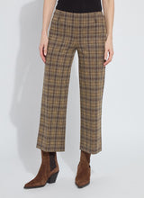 Load image into Gallery viewer, Model wearing brown plaid sparkle pants and brown suede boots against a white background.

