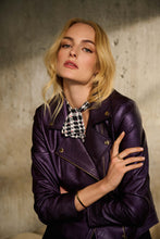 Load image into Gallery viewer, Elevate your wardrobe with the Mira Metallic Faux Leather Biker Jacket in Blackcurrant. This stunning purple jacket features a sleek notched collar, eye-catching metallic shine, and practical zippered pockets for a bold and attention-grabbing look.
