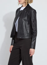 Load image into Gallery viewer, Woman wearing a black textured jacket over a white shirt and black pants against a white background.
