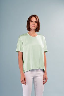 Enhance your wardrobe with the Mint Satin Short Sleeve Tee by Insight New York. Ideal as a standalone piece or layered under a jacket or blazer, this top boasts a luxurious satin fabric that will help you stay cool on those sunny days. Add a touch of sophistication to any outfit with this elevated essential.