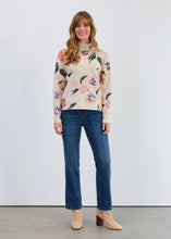 Load image into Gallery viewer, Woman wearing a floral sweater, jeans and tan boots against a white background.
