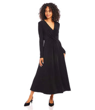 Load image into Gallery viewer, Woman wearing a black twist front midi dress and black heels on a white background.
