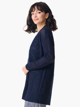 Load image into Gallery viewer, A striking, feminine cardigan full of head-turning details, this is the simple yet striking cardigan every closet needs. We love the dropped shoulder silhouette, the open front, and the knit in mesh texture and rib details along the side seam. Made from our fan-favorite Vital yarn in a deep indigo with just a little bit of cream mixed into the yarn to add some depth. Mindfully Made from cotton sourced from the largest cotton sustainability program in the world.
