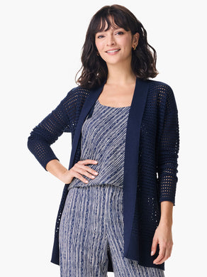 A striking, feminine cardigan full of head-turning details, this is the simple yet striking cardigan every closet needs. We love the dropped shoulder silhouette, the open front, and the knit in mesh texture and rib details along the side seam. Made from our fan-favorite Vital yarn in a deep indigo with just a little bit of cream mixed into the yarn to add some depth. Mindfully Made from cotton sourced from the largest cotton sustainability program in the world.