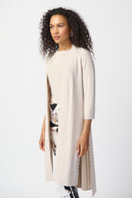 Load image into Gallery viewer, This stylish cover-up/cardigan features extended side openings and flared sleeves that impart a sense of fluidity and grace while in motion. The decorative studs along the openings add a touch of bold sophistication, making it perfect for both professional and casual settings.  Color- Moonstone. Drape silhouette. No pockets. No zipper. Not lined. Side splits lined with silver hardware.
