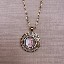 Load image into Gallery viewer, Gold necklace with a circular pendant featuring a religious icon on a beige background

