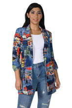 Load image into Gallery viewer, Experience the ultimate in style with the Frank Lyman jacket. This eye-catching piece features a striking abstract print and modern lapel collar. The edge-to-edge design offers a relaxed, open front look, complemented by 3/4 length sleeves, turn-up cuffs, faux pockets, shoulder pads, and a loose fit. Pairs beautifully with denim, white or black trousers.  Color- Red, blue, yellow, black, green, white. Abstract print. Three quarter sleeves. Turn up cuffs. Faux pockets. Shoulder pads. Open front.
