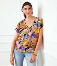Load image into Gallery viewer, Expertly crafted from luxurious cupro fabric, this top combines tropical charm with a relaxed sophistication. The Dolman sleeves add a touch of casual elegance, creating a comfortable and laid-back fit that effortlessly complements your style. With its vibrant and breezy design, this top is perfect for any occasion.
