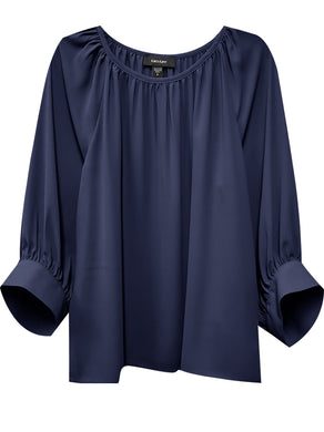Embrace the luxurious comfort of silky crepe fabric and the timeless elegance of flouncy sleeves with this wardrobe staple. The versatility of this top allows you to pair it with your favorite denim for a casual daytime look or dress it up with tailored trousers or a skirt for a more polished appearance. 