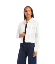 Load image into Gallery viewer, Woman wearing a white jacket over a black top and dark blue jeans on a white background.

