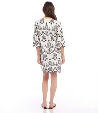 Load image into Gallery viewer, Experience the enchanting charm of this embroidered dress and unleash your inner bohemian spirit. Capturing the essence of effortless sophistication, this dress includes a gentle lining to preserve the integrity of the design and intricate eyelet accents that exude a feeling of uninhibited self-assurance.
