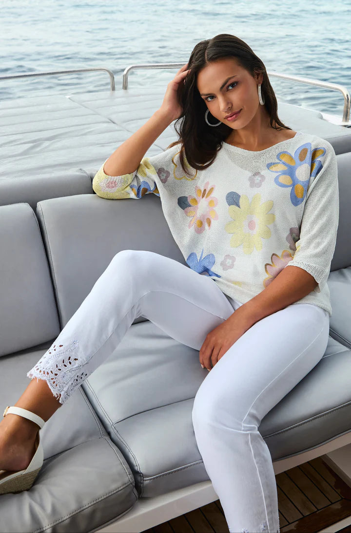 The Frank Lyman Pant is a timeless addition to any wardrobe, blending sophistication and comfort effortlessly. Designed with a soft off-white hue, these pants exude elegance, making them perfect for any occasion.  The Onike features a beautifully detailed hem that adds a touch of elegance and sophistication. The ankle-length design is enhanced with intricate embroidery and cut-out accents, creating a refined yet modern aesthetic.