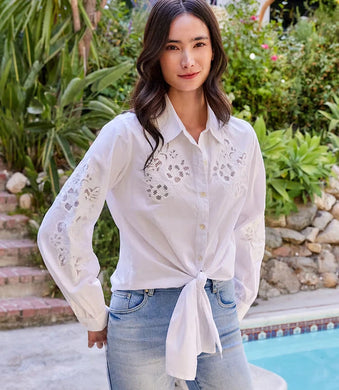 This lovely top is constructed with cotton fabric, allowing for softness and breathability. It showcases a floral embroidery in an eyelet design, elevating any ensemble with a touch of sophistication and femininity.
