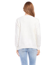 Load image into Gallery viewer, This essential pullover sweater is crafted from luxuriously textured yarns. Its off white hue and soft, cozy feel make it the perfect complement to any bottom--from jeans to skirts to pants. Color- Off white. Long sleeve. V-neck. Oversized fit. Super soft fabrication.
