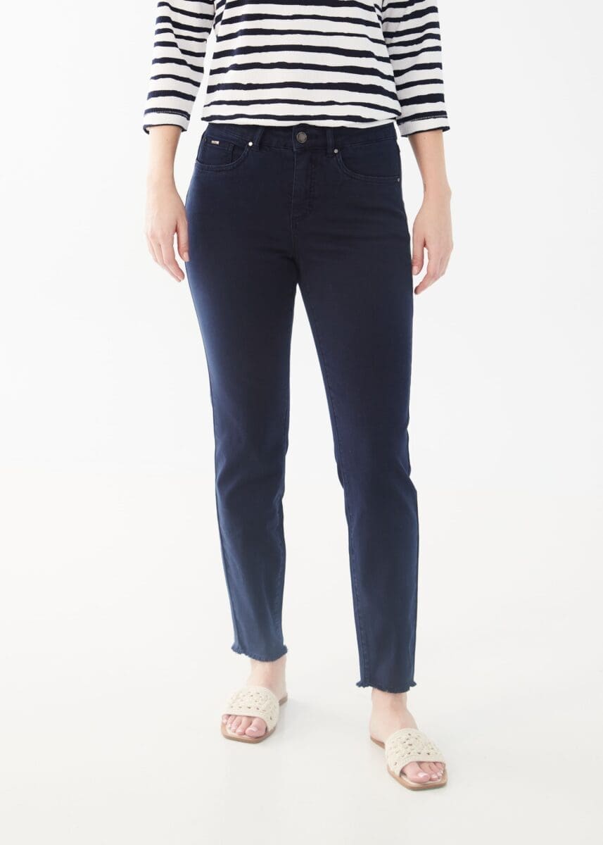 The contoured waistband of the Olivia Slim Ankle Jean in Navy by FDJ-French Dressing comfortably sits just below the natural waistline. This classic wardrobe staple has a trendy twist, featuring an ankle length style with slight frayed hems.  Color- Navy. Button and zipper closure. Slight fray at the bottom hems. Ankle length. Inseam- 28