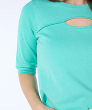 Load image into Gallery viewer, This short sleeve sweater features a circle opening near the neckline, giving it a unique and modern look. Perfect for the spring/summer season, it adds a touch of edginess to any outfit. The beautiful color adds to its spring/summer appeal.
