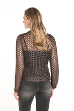 Load image into Gallery viewer, Woman wearing a brown open knit sweater and black jeans against a white background.
