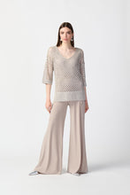 Load image into Gallery viewer, Enhance your wardrobe with a stylish and elegant top that features mini sequins and an open stitch design. Made with an acrylic blend knit, this sweater adds a touch of sparkle to any outfit and boasts a relaxed fit with drop shoulders, three-quarter sleeves, and side slits for maximum comfort.  Color- Champagne. Sweater knit. V-neckline. Three-quarter sleeves. Adorned with mini sequins.
