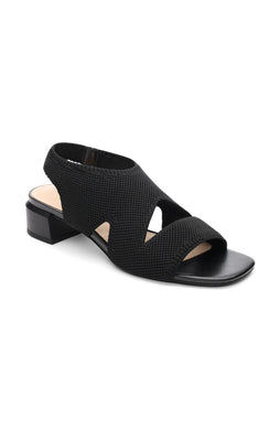 These stylish black slip-on sandals combine fashion and comfort, thanks to a flexible knit fabric and sleek organic heel. Elevate your look while staying comfortable all day long.