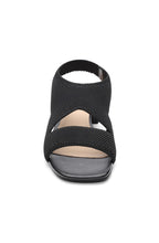 Load image into Gallery viewer, These stylish black slip-on sandals combine fashion and comfort, thanks to a flexible knit fabric and sleek organic heel. Elevate your look while staying comfortable all day long.
