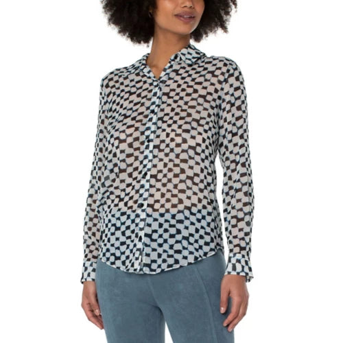 Introducing the Pippa Painted Checks Button Up Woven Blouse. This fashion-forward piece showcases an abstract pattern in shades of blue on a white background, making it a must-have for any season. Pair it with your favorite denim for a stunning ensemble. For added coverage, we recommend layering the Pippa top with a tank or cami as the top is slightly sheer.  Color- Blues and white. Button down. Long sleeve.
