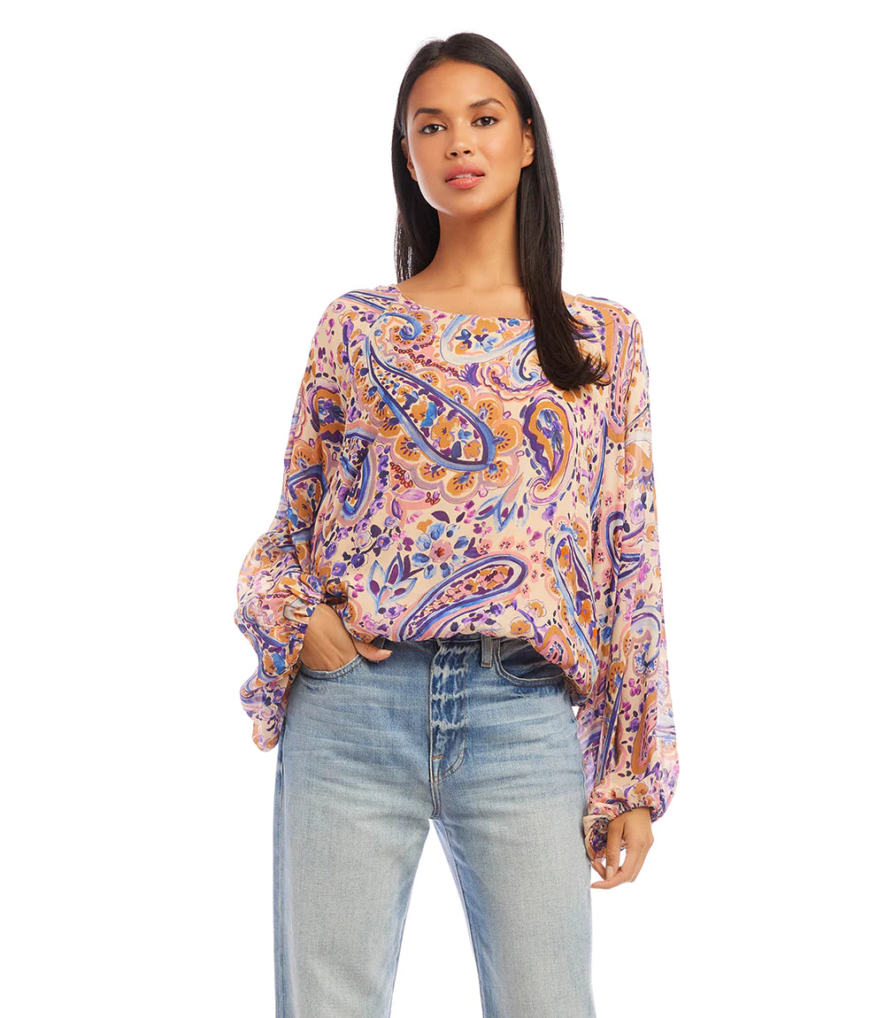 This stylish top features billowing blouson sleeves and a captivating paisley print. It pairs well with denim and is really a perfect top for any occasion.  Color-Blues, purples, pink, gold. Watercolor paisley print. Crew neck. Elasticized hem. Lined. Italian fabric -100% Viscose.