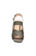 Load image into Gallery viewer, This heeled sandal in a gorgeous olive boasts a retro look, complete with inked edge details and a subtle icon buckle. Elevate any outfit with a touch of elegance.
