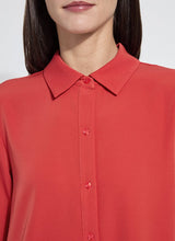 Load image into Gallery viewer, Close-up of model wearing a red shirt worn against a plain background.
