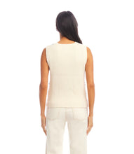 Load image into Gallery viewer, Woman wearing a sleeveless floral-patterned crochet top and cream pants against a white background.

