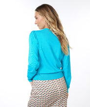Load image into Gallery viewer, Experience luxurious comfort with our Tamara cardigan. Its soft knit fabric provides a cozy fit. This cardigan, featuring puff sleeves and sparkling etched silver buttons adds a stylish and lively touch to any ensemble. An indispensable piece for a fashionable and adaptable look!  Color - Turquoise. Button down. Silver etched buttons. Puff sleeve detailing.
