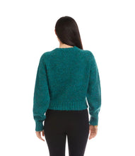 Load image into Gallery viewer, Woman wearing a teal cardigan with pearl buttons and black pants against a white background.
