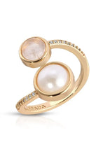Load image into Gallery viewer, A gold-toned open wrap ring featuring a large white pearl and a moonstone, accented with small clear stones along the band, with the brand name LEEADA engraved inside against a white background.
