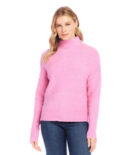 Load image into Gallery viewer, The mock neck sweater in a beautiful peony pink color is crafted from a soft and cozy boucle fabric that adds a touch of texture to your outfit. Its classic design is perfect for staying warm and stylish during colder months.
