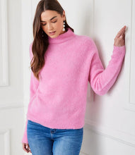 Load image into Gallery viewer, The mock neck sweater in a beautiful peony pink color is crafted from a soft and cozy boucle fabric that adds a touch of texture to your outfit. Its classic design is perfect for staying warm and stylish during colder months.
