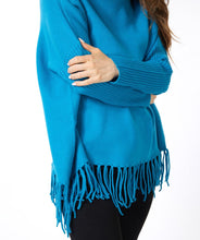 Load image into Gallery viewer, Uncover effortless boho-inspired style with our &quot;Sweater Col Fringes&quot;. Carefully crafted with a soft material for a comfortable fit, this turtleneck sweater with fringes provides a fashionable and relaxed look. Perfect for achieving a fashionable and comfortable ensemble.  Color- Petrol. Pullover. Turtleneck. Fringe detailing at hem. Ribbed Sleeves.
