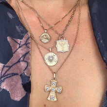 Load image into Gallery viewer, Close-up of a model wearing a blue floral print top and multiple gold necklaces with various pendants.
