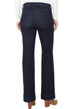 Load image into Gallery viewer, Model wearing dark blue jeans, white top and brown suede boots against a white background.
