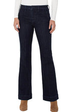 Load image into Gallery viewer, Model wearing dark blue jeans, white top and brown suede boots against a white background.
