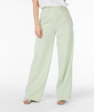 Load image into Gallery viewer, These gorgeous City Trousers in Pistachio are back in stock. With an elastic waistband and a wide leg design, they provide both comfort and style. Dress them up with heels or down with sneakers - the choice is yours. A must-have for any fashion-savvy wardrobe.
