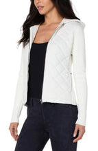 Load image into Gallery viewer, This diamond quilted hooded sweater jacket offers both comfort and easy wearability with ultimate style.  This versatile addition to your wardrobe pairs well with denim and sneakers for a casual vibe or can be dressed up with leggings and heels for a chic evening look. Color- Porcelain (off white.) Quilted front and hoodie with sweater sleeves and back. Long sleeve. Full zip.
