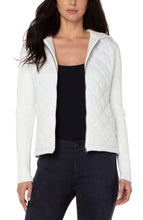 Load image into Gallery viewer, This diamond quilted hooded sweater jacket offers both comfort and easy wearability with ultimate style.  This versatile addition to your wardrobe pairs well with denim and sneakers for a casual vibe or can be dressed up with leggings and heels for a chic evening look. Color- Porcelain (off white.) Quilted front and hoodie with sweater sleeves and back. Long sleeve. Full zip.
