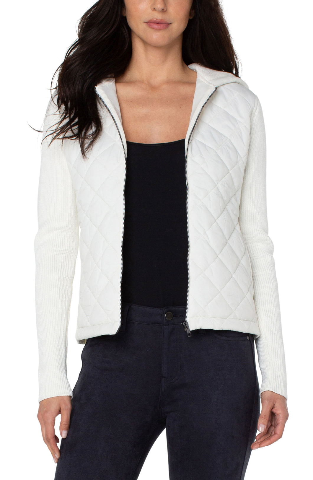 This diamond quilted hooded sweater jacket offers both comfort and easy wearability with ultimate style.  This versatile addition to your wardrobe pairs well with denim and sneakers for a casual vibe or can be dressed up with leggings and heels for a chic evening look. Color- Porcelain (off white.) Quilted front and hoodie with sweater sleeves and back. Long sleeve. Full zip.