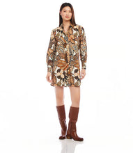 Load image into Gallery viewer, This shirtdress, expertly crafted from premium French cotton, showcases a striking safari floral print. The design is elevated by blouson sleeves and elegant gold buttons. Incorporate a piece of French style into your wardrobe with this sophisticated and stylish dress.
